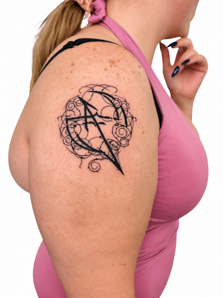 Fine line geometric shoulder tattoo