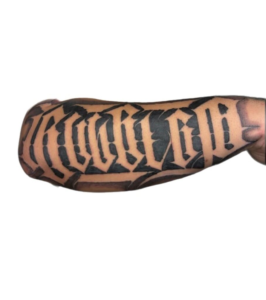 Bold blackletter script forearm tattoo, Perth WA