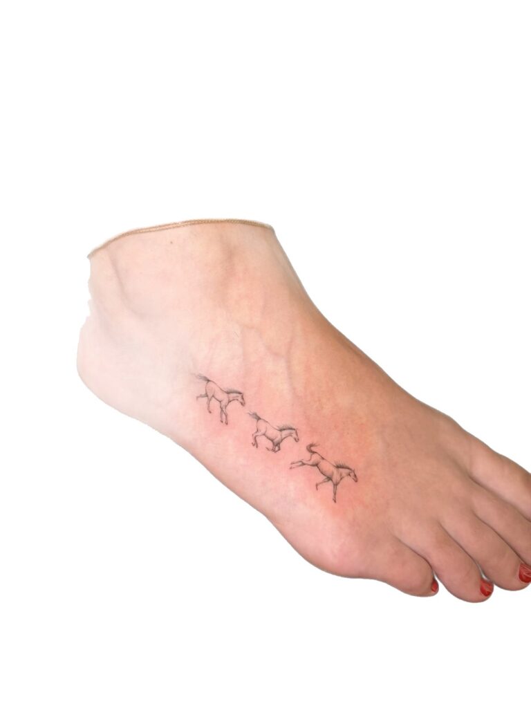 Fine line running horses foot tattoo
