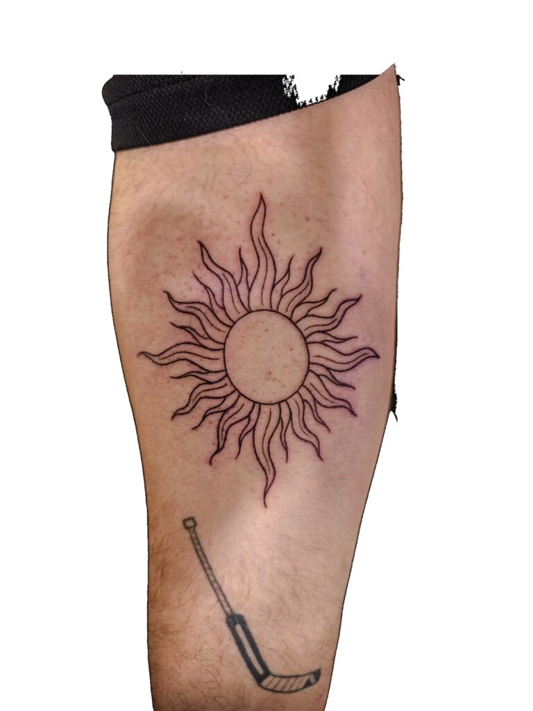 Fine line sun thigh tattoo